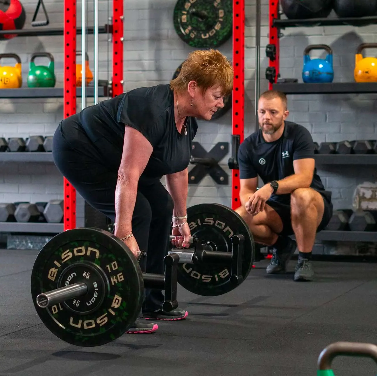 A Northward coach watching a member's deadlift technique
